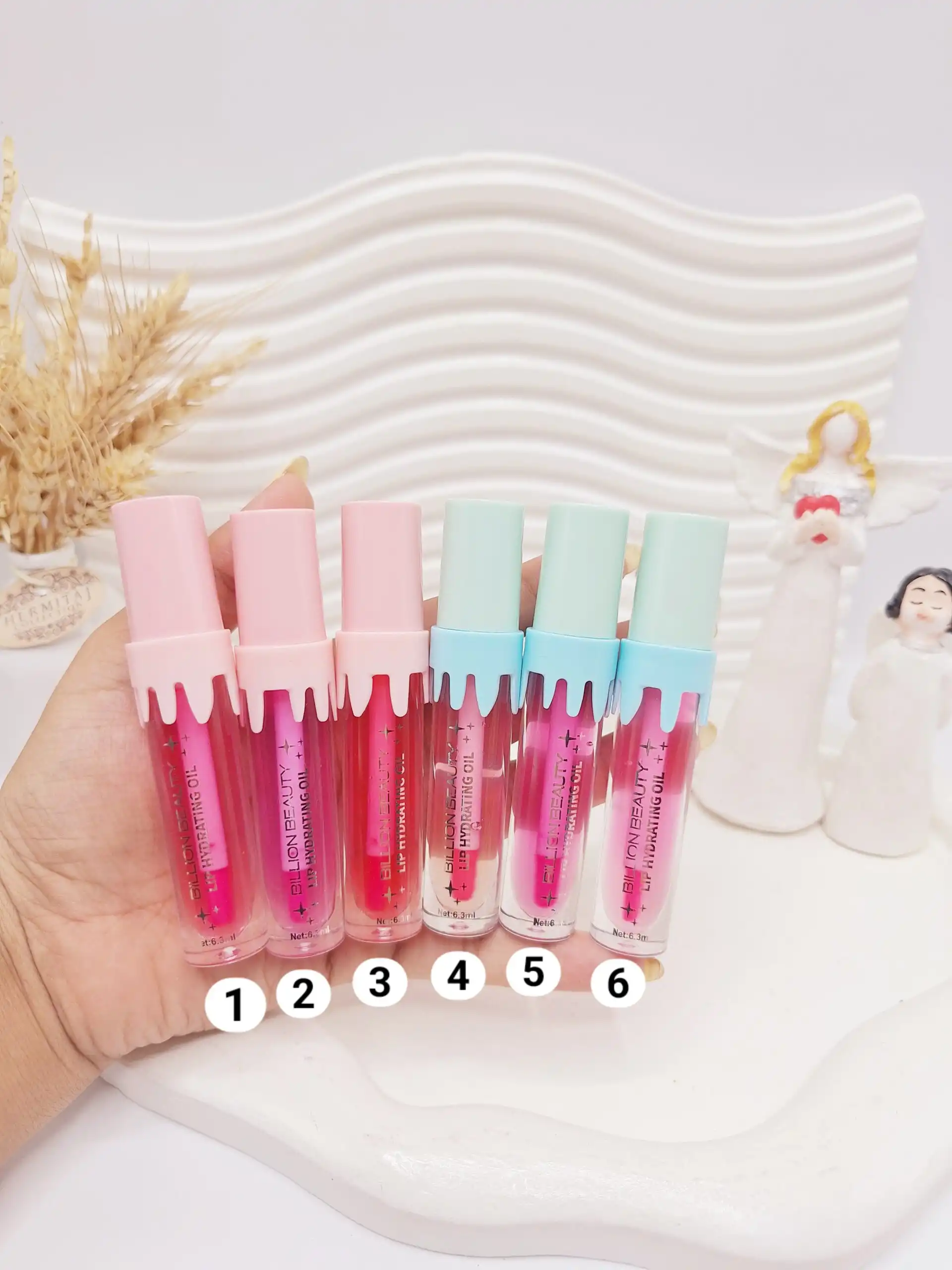 لیپ گلاس جذاب آیس پکی برند BILLION BEAUTY کد B80012